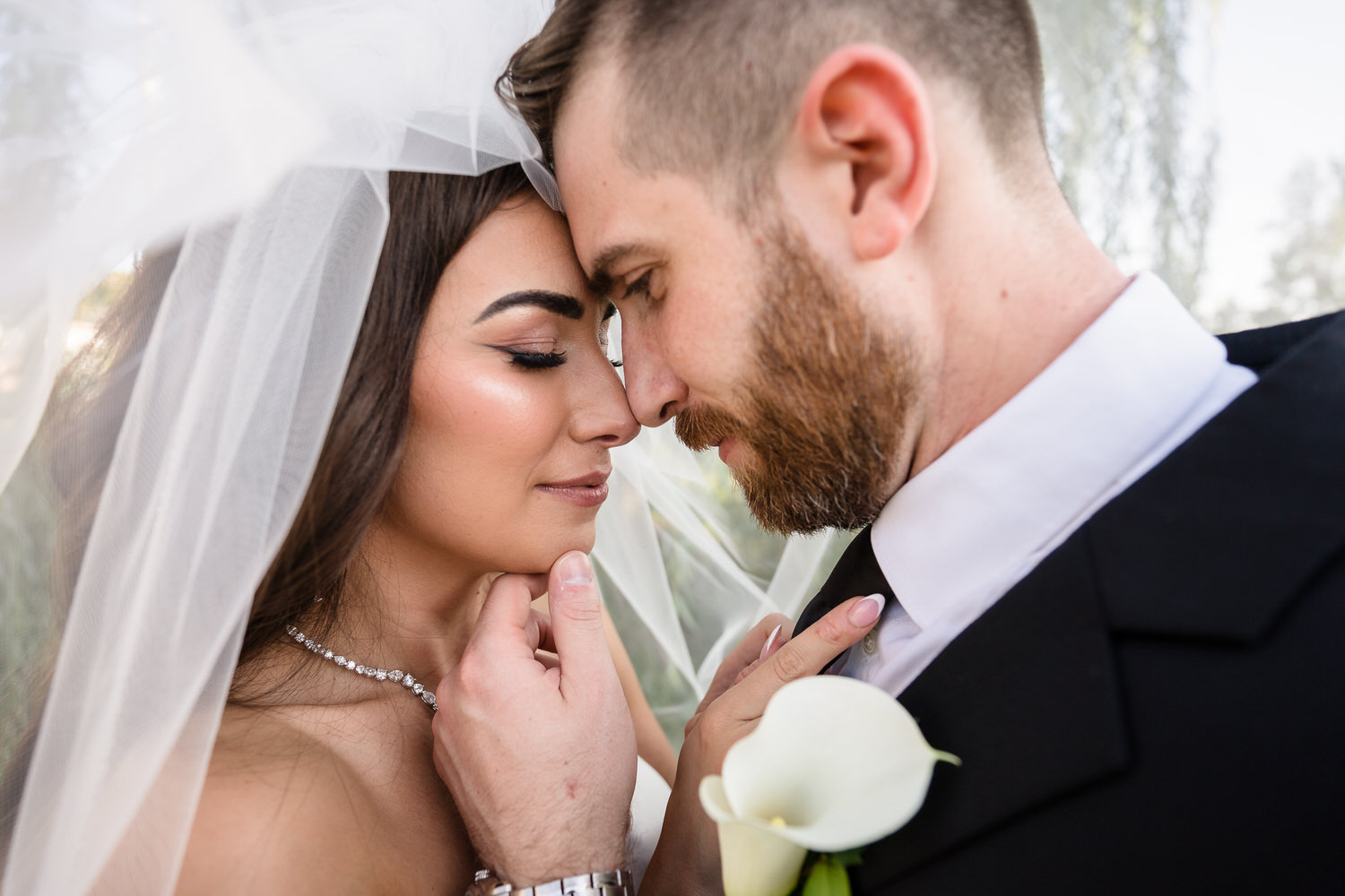 Close-up portrait of the couple sharing a quiet moment during their sunset session.