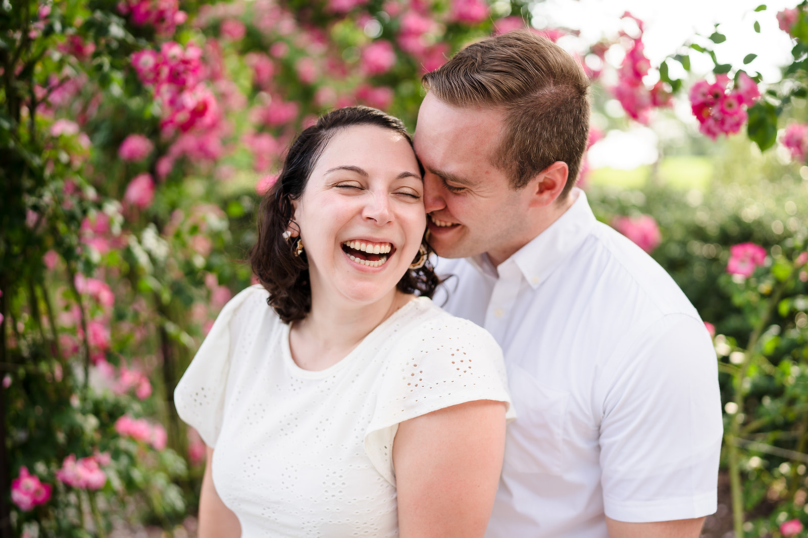Couple Laughing in a field of roses