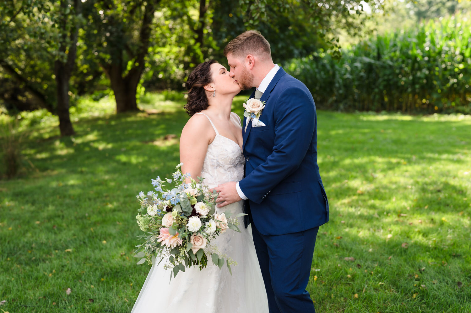 Close-up of the bride and groom sharing a romantic kiss during their portraits.