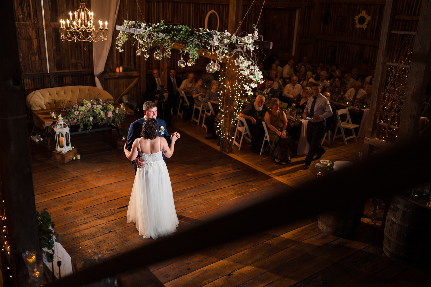 First dance of the bride and groom on the historic barn floor.