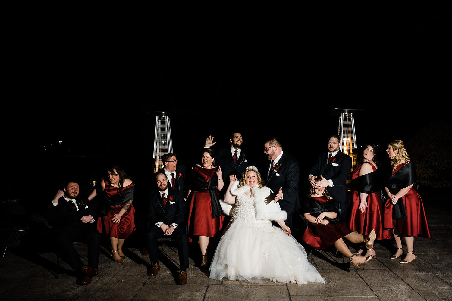 Fun wedding party photo at night with patio heaters at Northampton Valley Country Club in Bucks County.
