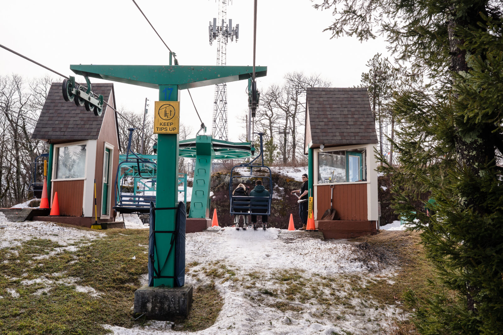 Ski lift base area with chairs and snowy ground at Elk Mountain Resort