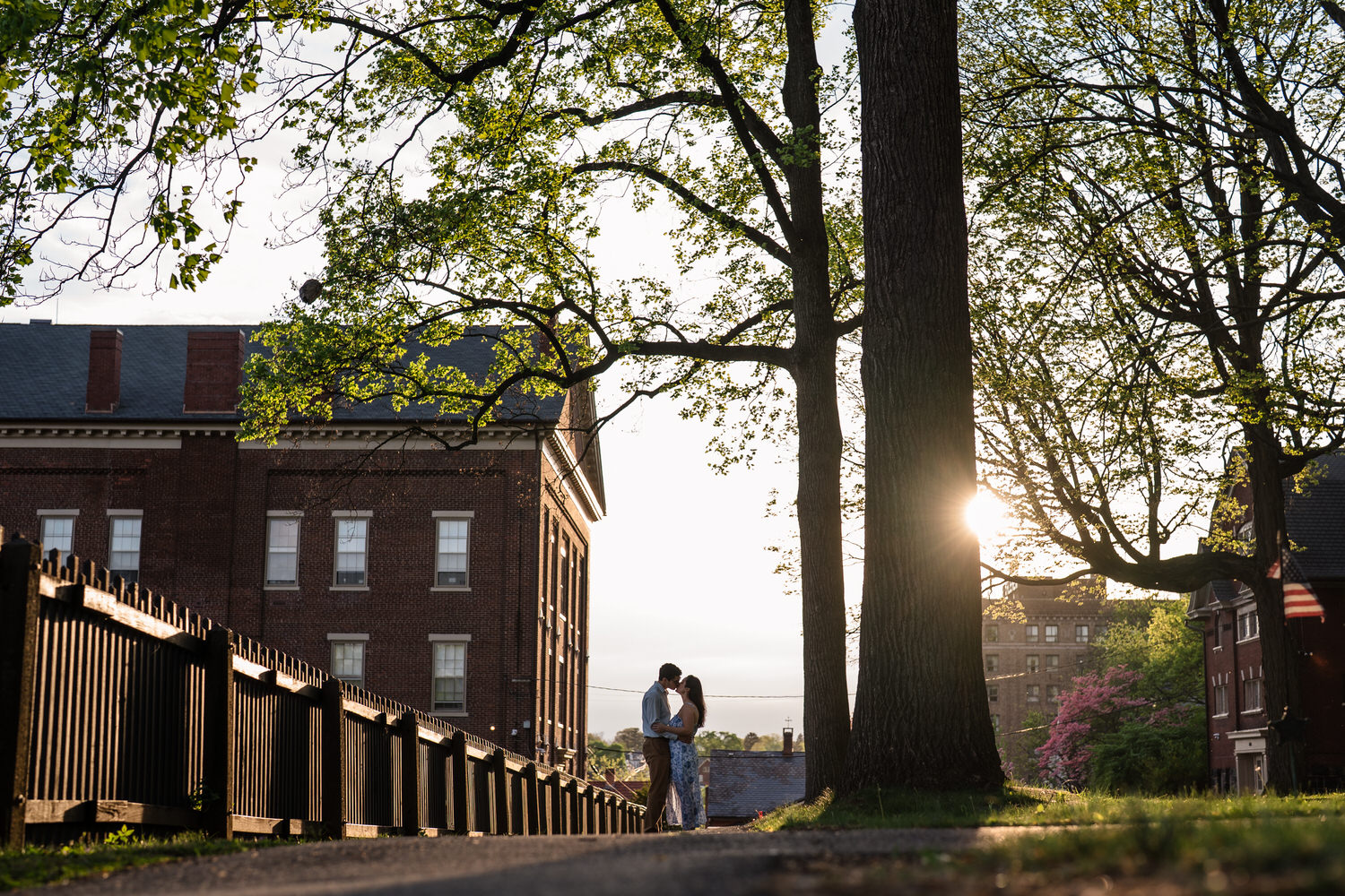 Distant silhouette of couple forehead to forehead at God's Acre