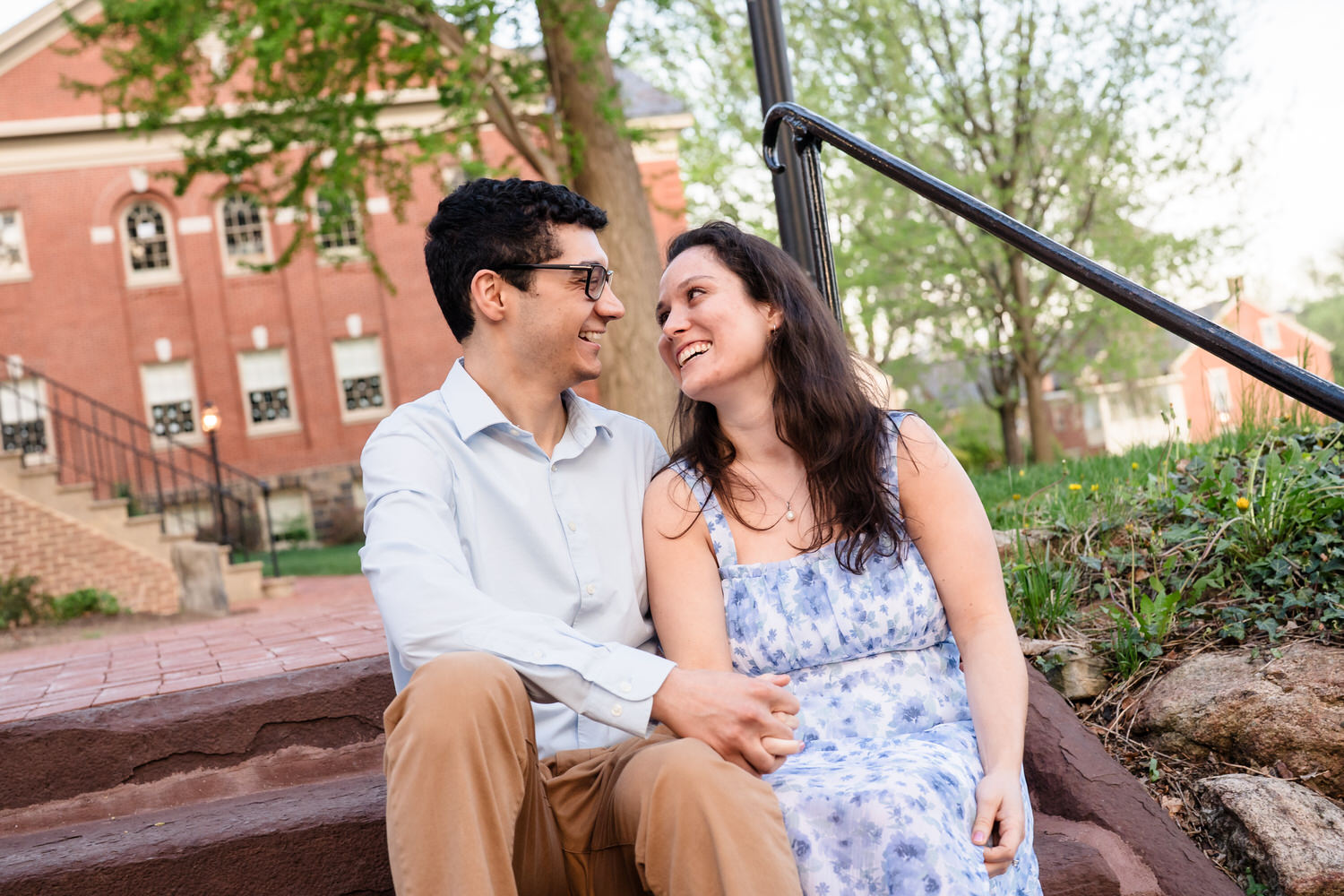 couple smiling at one another on the stairs at Moravian
