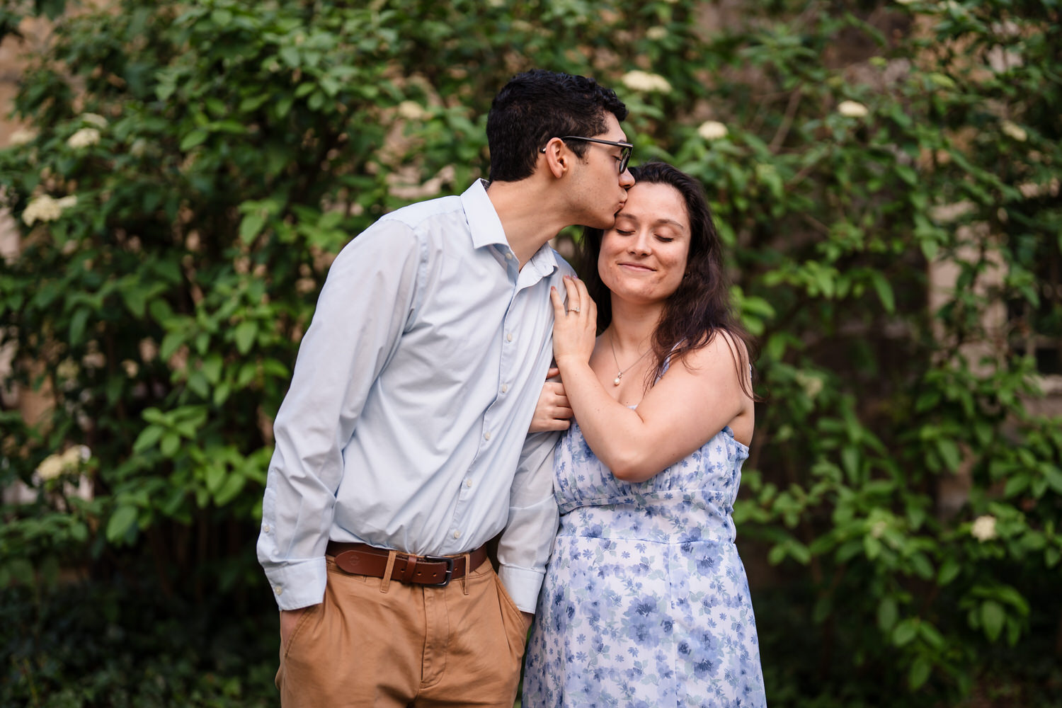 Cheek kiss between trees on the Moravian University campus
