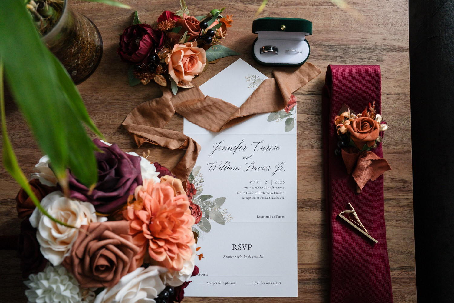 Wedding invitation and rings with orange floral styling