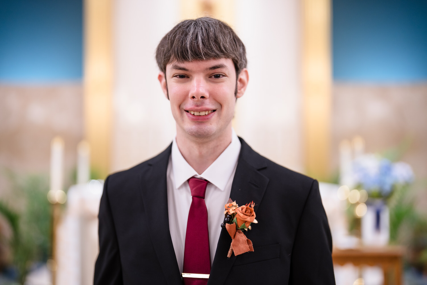 Groom portrait indoors before wedding ceremony