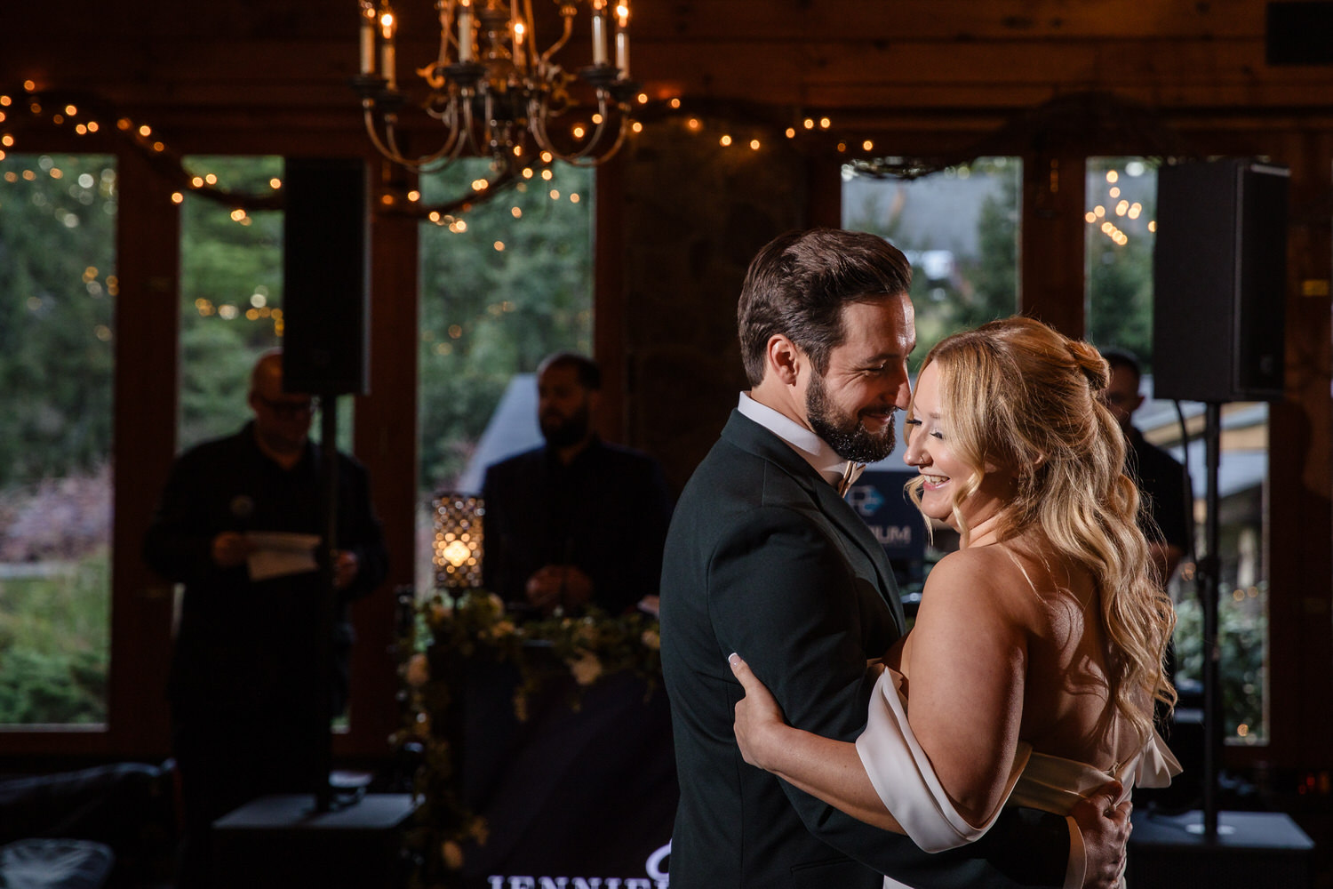 A bride and groom sharing a dance at a wedding reception.